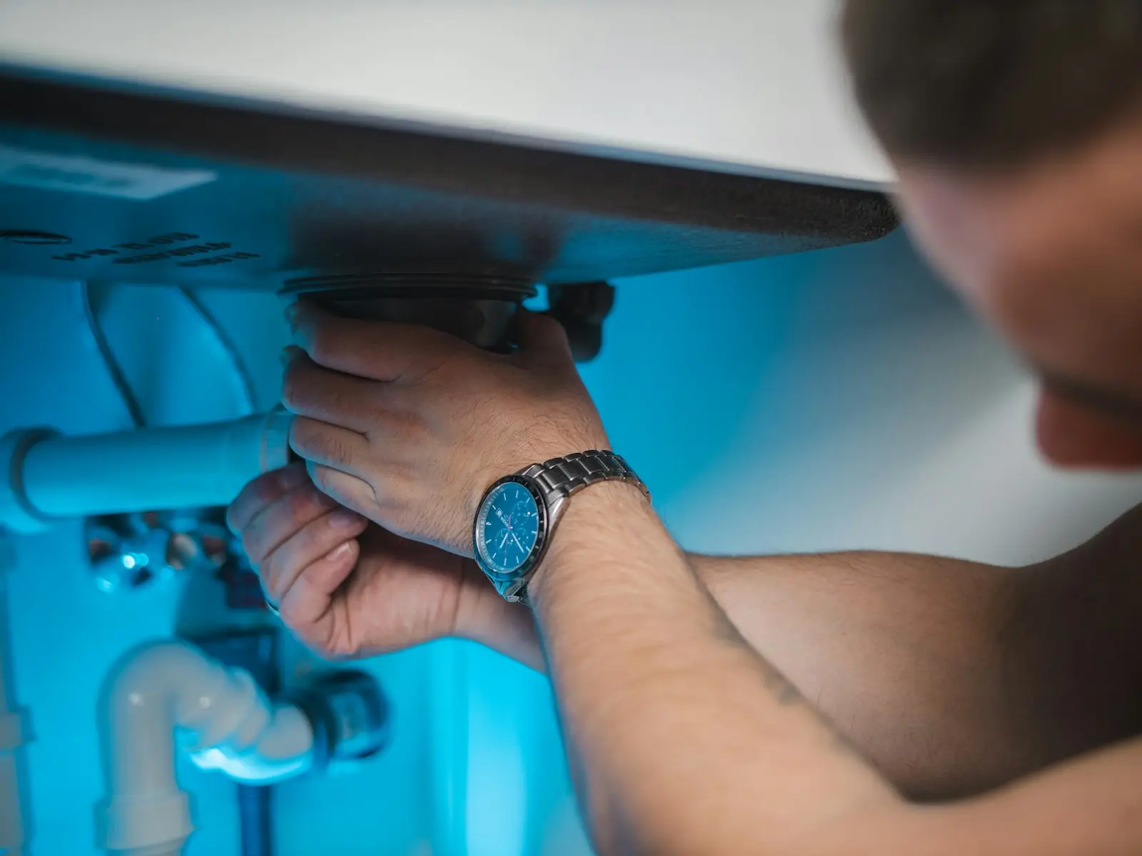 Engineer repairing a heating system